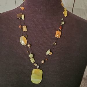 Green striated stone with brown beads necklace